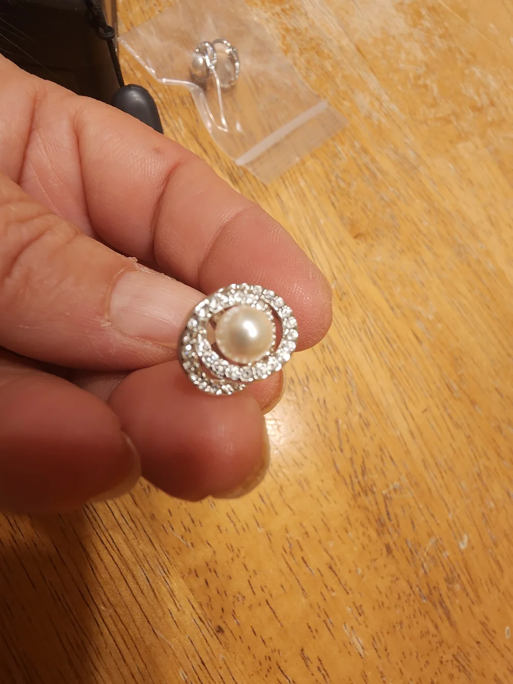 classic Swarovski Crystal Pearl clip ons featuring a central cream faux pearl